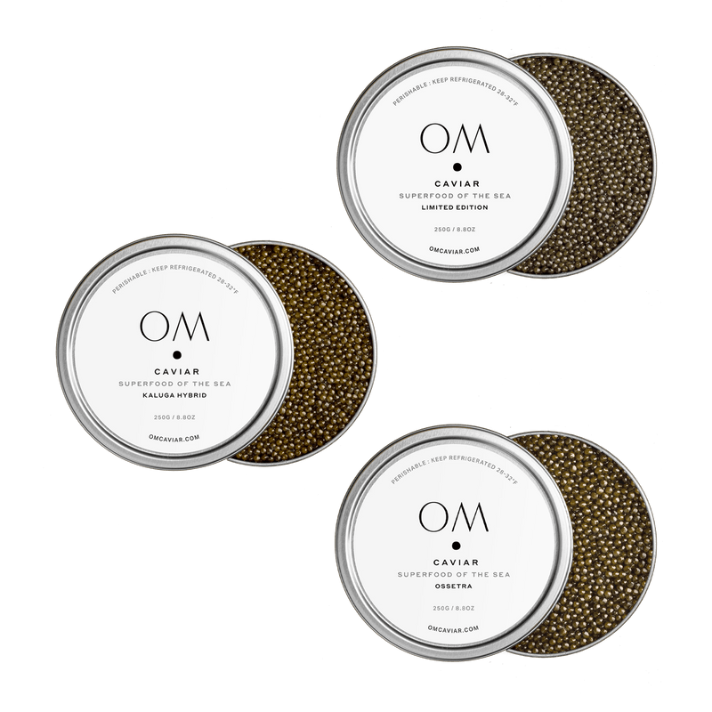 Three tins of OM Caviar Ultra Caviar Tasting Bundle with Ossetra, Kaluga Hybrid, and Limited Edition caviar varieties.