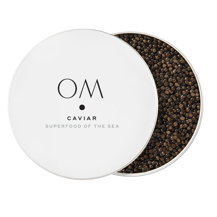 Open tin of OM Caviar Kaluga Hybrid with dark amber to brown pearls, premium River Beluga quality from sturgeons